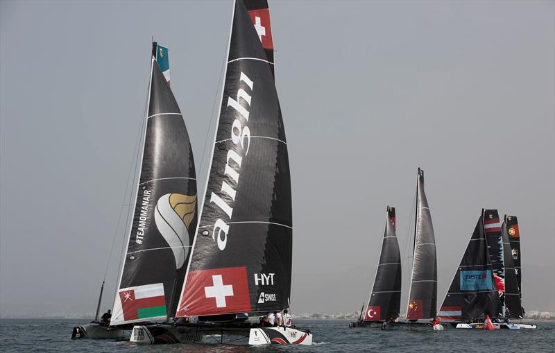 Alinghi & Oman Air jostle at the front of the fleet on day 3 at Extreme Sailing Series™ Act 1, Muscat photo copyright Lloyd Images taken at Oman Sail and featuring the GC32 class