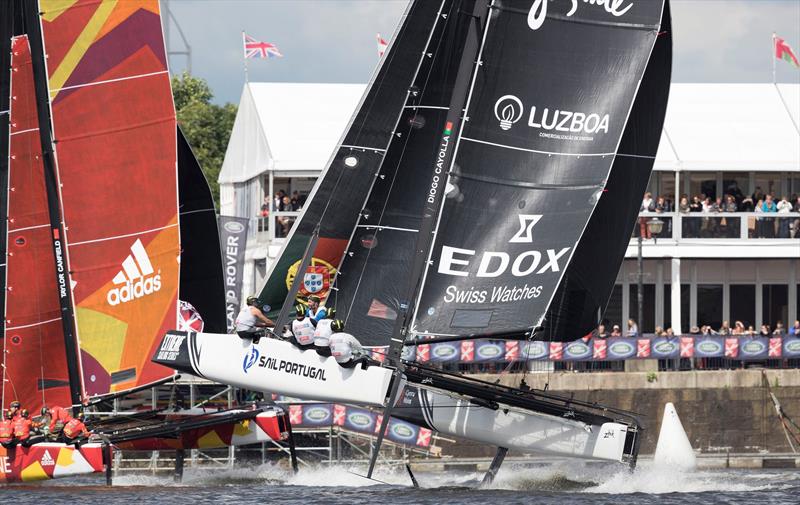 Sail Portugal and CHINA One charge across the finish line on day 3 of Extreme Sailing Series™ Act 3 in Cardiff Bay photo copyright Lloyd Images taken at  and featuring the GC32 class