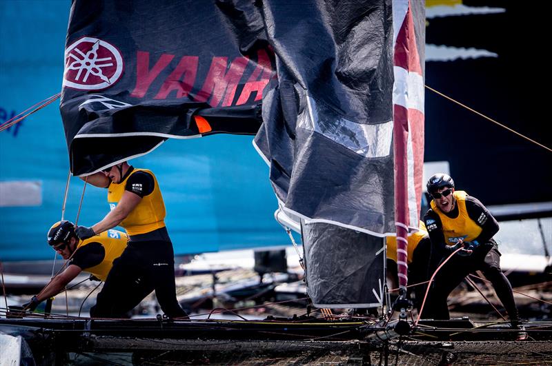 Hard graft on board SAP Extreme Sailing Team on day 1 of the GC32 World Championship at Garda photo copyright Pedro Martinez / GC32 taken at Fraglia Vela Riva and featuring the GC32 class