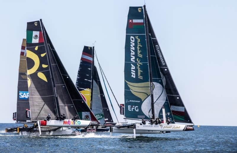Extreme Sailing Series Act 4, Cascais, Portugal. The GC32 fleet racing close to the shore on Day 1 photo copyright Sander van der Borch taken at  and featuring the GC32 class