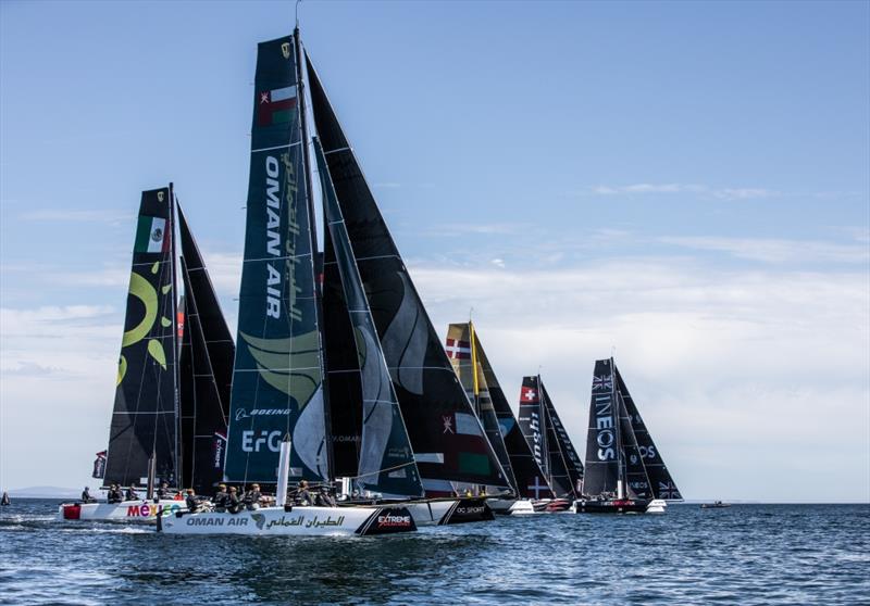 Extreme Sailing Series  - The GC32 fleet racing close to the shore photo copyright Oman Sail taken at  and featuring the GC32 class