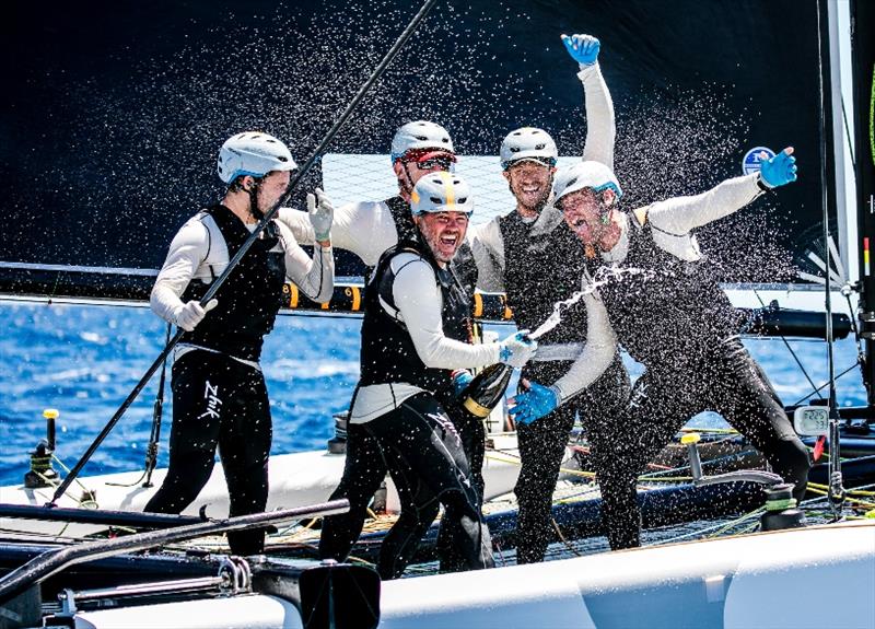 Jason Carroll and the crew of Argo celebrate winning the 2017 GC32 Villasimius Cup photo copyright Jesus Renedo / GC32 Racing Tour taken at  and featuring the GC32 class