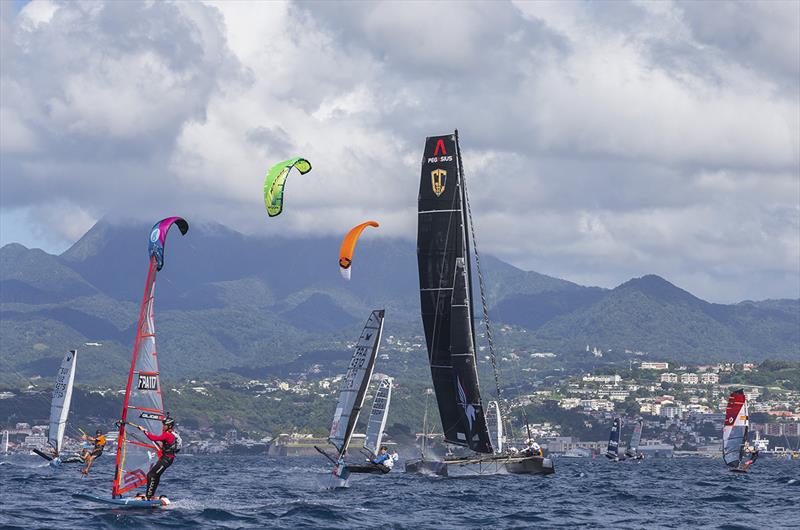 The mighty NORAUTO takes on the tiddlers at the start of the coastal Raid photo copyright Jean-Marie Liot / Martinique Flying Regatta taken at  and featuring the GC32 class