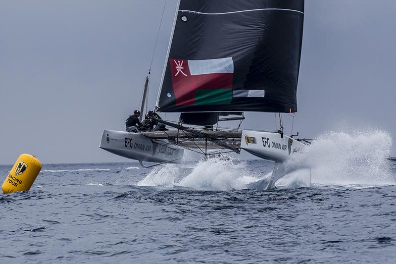 Oman Air on fire coming into the leeward gate - 2019 GC32 Racing Tour - Villasimius Cup photo copyright Sailing Energy / GC32 Racing Tou taken at  and featuring the GC32 class