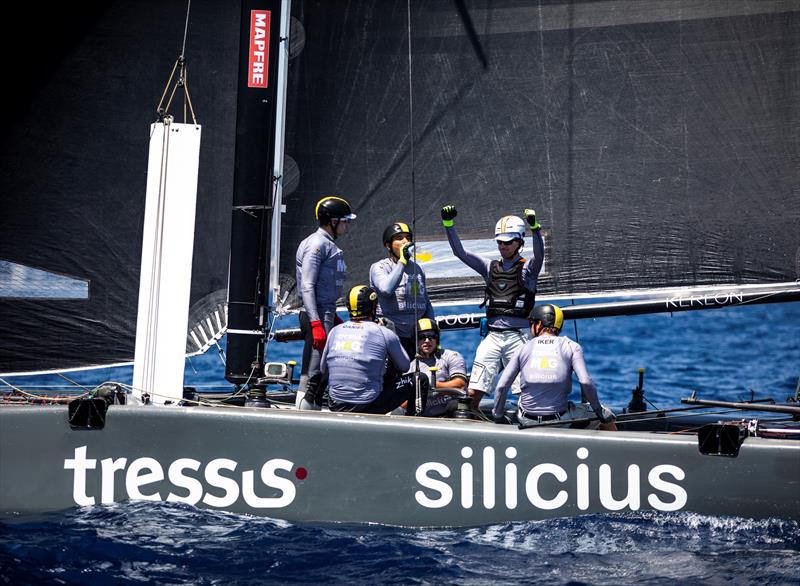 High fives on board Iker Martinez's M&G Tressis Silicius after winning today's first race. - Copa del Rey MAPFRE. - photo © Tomas Moya / Sailing Energy / World Sailing / GC32 Racing Tour
