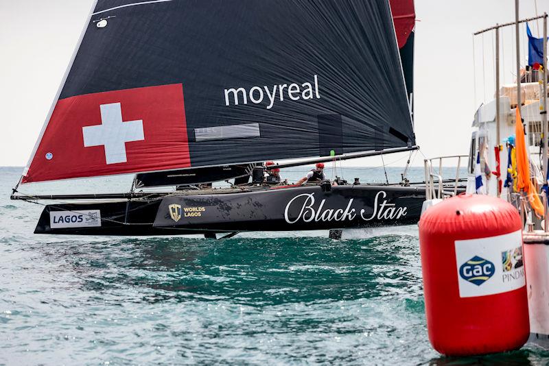 Black Star Sailing Team crosses the finish line at the Lagos GC32 Worlds photo copyright Sailing Energy / GC32 Racing Tour taken at Clube de Vela de Lagos and featuring the GC32 class