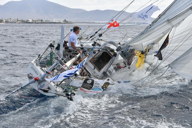 Tapio Lehtinen (FIN) sailing his Gaia 36 Asteria through the Marina Rubicon gate off Lanzarote. Asteria has the lowest freeboard of all the yachts in the GGR. - photo © Christophe Favreau / PPL / GGR