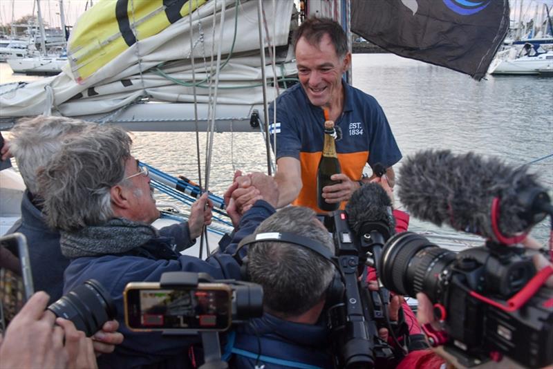 Media scrum: Lehtinen besieged by media and fellow Golden Globe race skippers wanting a word and to welcome him back photo copyright Christophe Favreau / PPL / GGR taken at  and featuring the Golden Globe Race class