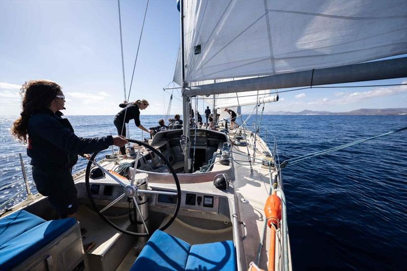 Pen Duick VI, fresh out of refit, is looking magnificent. Marie Tabarly enjoying at her helm. She is now in the Canary Islands after a 1200-mile passage and splashing on December 14 - photo © Martin Keruzoré