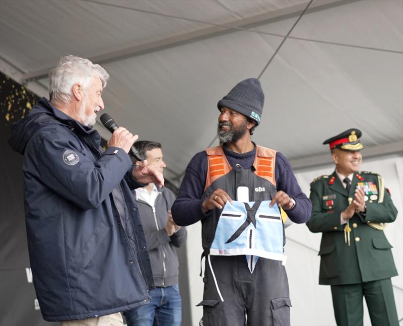 Indian yachtsman Abhilash Tomy, 2nd placed finisher in the 2022/3 Golden Globe Race, receiving his Cape Horners burgee from Jean-Luc Van Den Heede, Vice President of the International Association of Cape Horners photo copyright Rob Havill / GGR / PPL taken at  and featuring the Golden Globe Race class