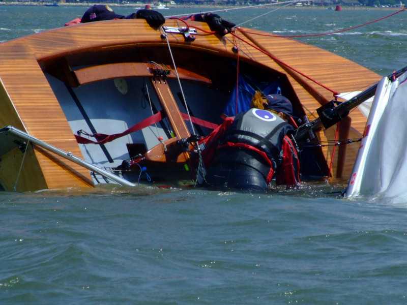 A capsize during the Piplers of Poole GP14 Southerns photo copyright Poole GP14s taken at Poole Yacht Club and featuring the GP14 class