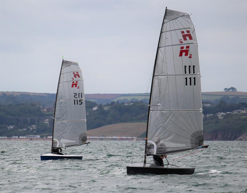 Ian Sanderson in H2 #111 'Shifty Fades Away' leads Richard Leftley in H2 #115 'H2oligan' on day 2 of the Hadron H2 Nationals in Torbay photo copyright Keith Callaghan taken at Royal Torbay Yacht Club and featuring the Hadron H2 class