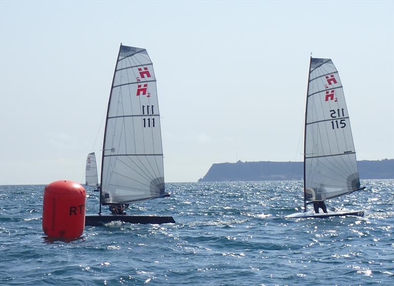 Ian Sanderson passes Richard Leftley at the last mark, Race 8 on day 3 of the Hadron H2 Nationals in Torbay photo copyright Keith Callaghan taken at Royal Torbay Yacht Club and featuring the Hadron H2 class