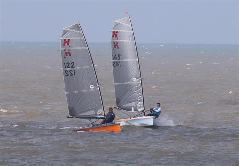 Richard Leftley (145) and Roger Ewart-Smith (122) on the bottom reach, race 2 on day 1 of the Hadron H2 Nationals at Herne Bay photo copyright Keith Callaghan taken at Herne Bay Sailing Club and featuring the Hadron H2 class