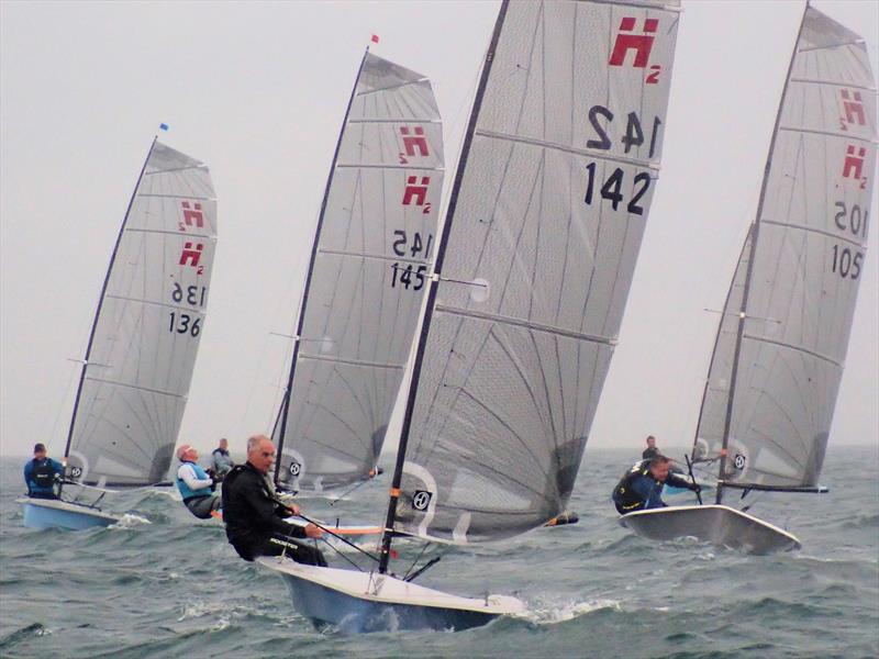 Close racing on day 3 at the Hadron H2 Nationals photo copyright Sarah Desjonqueres taken at Highcliffe Sailing Club and featuring the Hadron H2 class