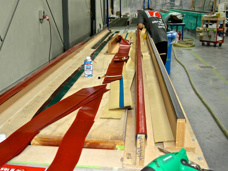 Hall Spars - Battens are laid up on wooden formers before being inserted in the mould. The outer strip of carbon on the flex batten runs for its full length photo copyright Richard Gladwell taken at  and featuring the  class