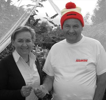 Peter Bullick makes a donation to the RNLI Bangor Lifeboat Station Fund - photo © Harken UK