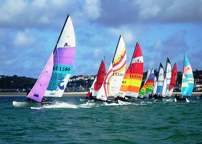 Hobie 16s racing off the start line photo copyright Bill Harris taken at Royal Channel Islands Yacht Club and featuring the Hobie 16 class