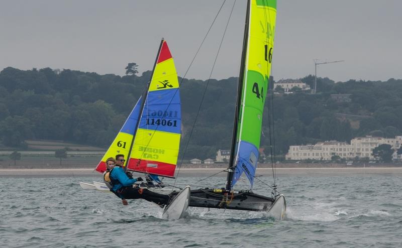 Rubicat - Ollie Voak and Owen Harper - Rossborough Round the Island Race 2018 photo copyright Simon Ropert taken at Royal Channel Islands Yacht Club and featuring the Hobie 16 class