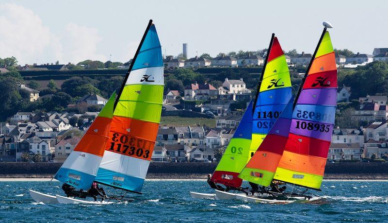 Royal Channel Islands YC Spring Regatta class 6 - Purr Energy leads the pack photo copyright Simon Ropert taken at Royal Channel Islands Yacht Club and featuring the Hobie 16 class