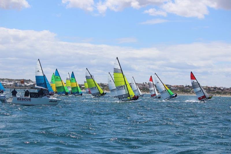 Hobie Cat 16's flying off the start photo copyright Kathy Miles taken at Esperance Bay Yacht Club and featuring the Hobie 16 class
