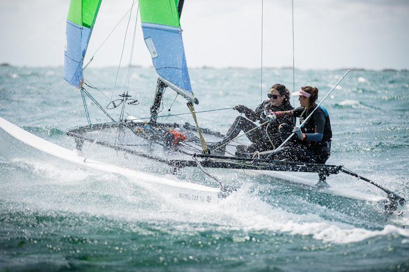 Elsa and Chloe Swetenham in the Estimating Services Minquiers Cat Dash photo copyright Jack Clayden taken at Royal Channel Islands Yacht Club and featuring the Hobie 16 class