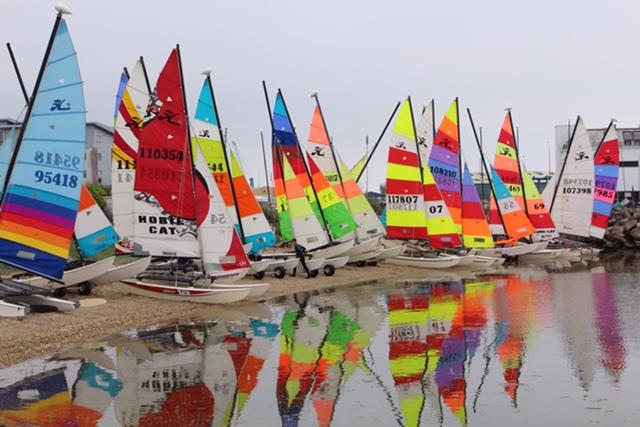 The Hobies lined up on the beach during the 2022 British National Hobie 16 Championship photo copyright Hazel Beard taken at Poole Yacht Club and featuring the Hobie 16 class