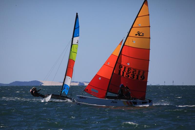 Queensland Hobie Cat State Championships - Shane & Tom making the cross on Lachy & Sharon photo copyright Spikey Mike taken at Royal Queensland Yacht Squadron and featuring the Hobie 16 class