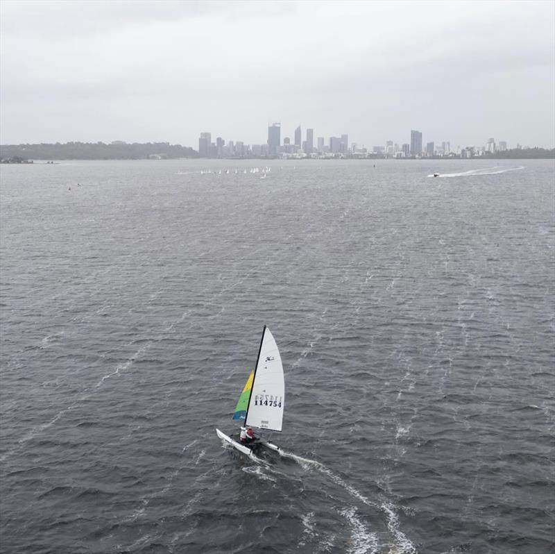 Hobie 16 Trent and Jas with the Perth skyline photo copyright SailsOnSwan taken at Nedlands Yacht Club and featuring the Hobie 16 class