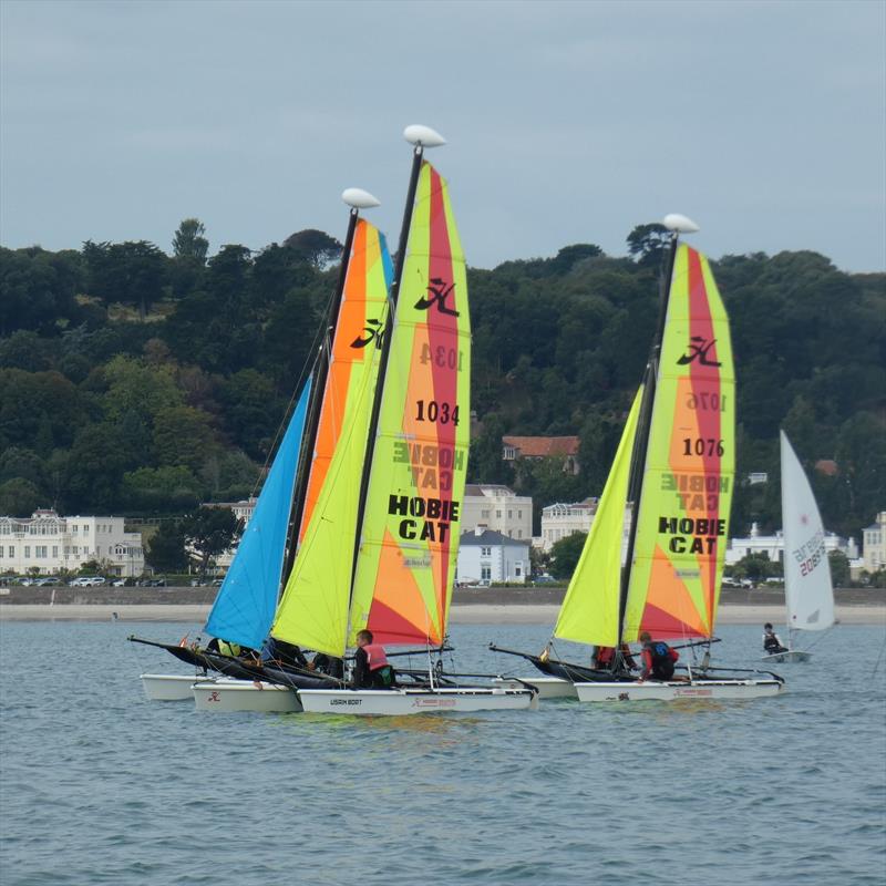 Class 7 - Junior sport catamaran start at the Carey Olsen Jersey Regatta 2021 photo copyright Elaine Burgis taken at Royal Channel Islands Yacht Club and featuring the Hobie Dragoon class