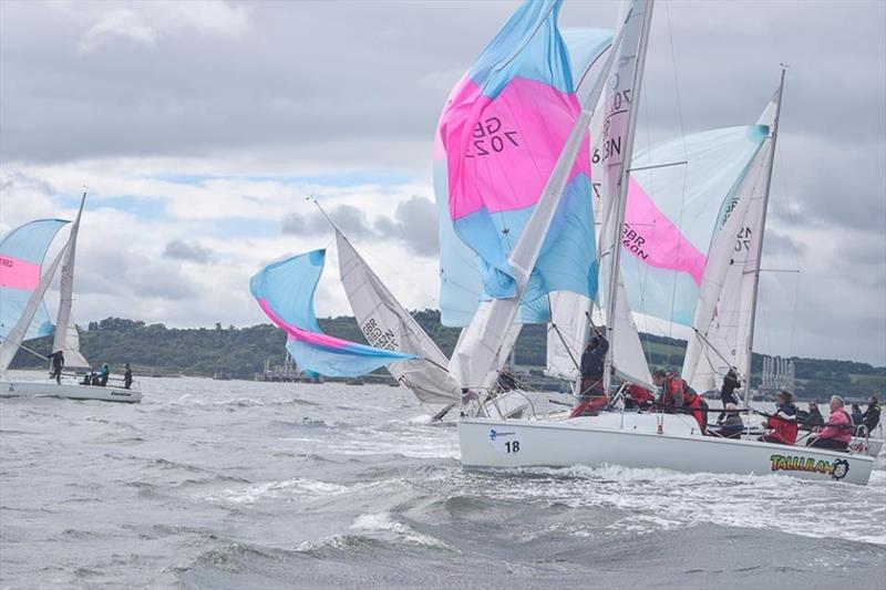 Totally unphased by the broaching boat, the fleet coolly carries on during the 707 Nationals at Port Edgar photo copyright 707 Class Association taken at Port Edgar Yacht Club and featuring the 707 class