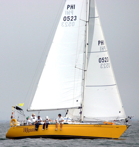 Harry Taylor’s Irresistible with a full wardrobe of Hyde Sails photo copyright Martyn Willes taken at Manila Yacht Club and featuring the  class