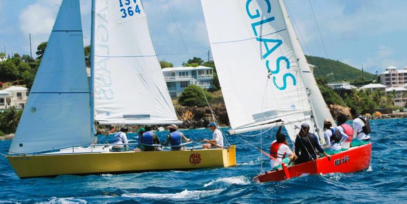 6th Annual USVI Hotel & Tourism Association Regatta - Team Frenchman's Cove (right, red hull) races hot on the heels of Team USVI Department of Tourism (left, yellow hull) - photo © STSC / C Bareuther