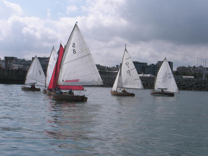 The fleet in light airs during the International 12 Foot and DBSC 12 Championship photo copyright Vincent Delany taken at Royal St George Yacht Club and featuring the International 12 class