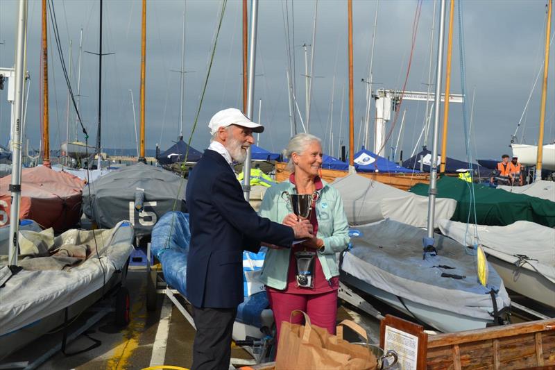 Irish 12 foot championships: Regatta organiser and PRO Vincent Delany presents the Edmond Johnson Trophy to Gail Varian of 12-9 'Albany' photo copyright Stratos Boumpoukis taken at Royal St George Yacht Club and featuring the International 12 class