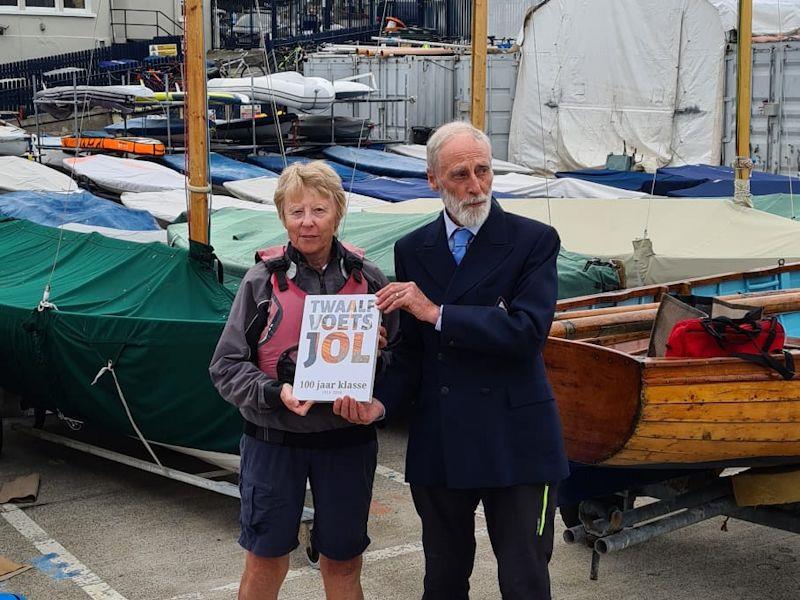 Margaret Delany receives the 'History of the international 12 foot dinghy class' from class President - County Dublin 12 Foot Dinghy Championship at the Royal St George Yacht Club - photo © Gail Varian