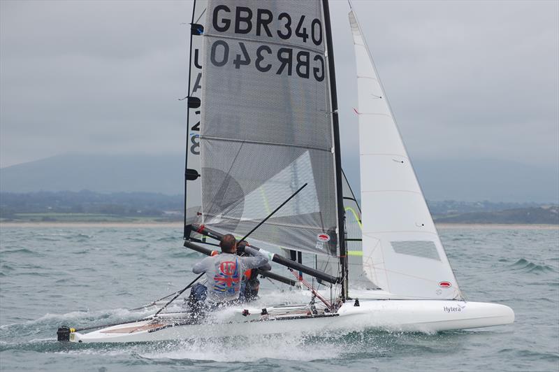 Chris Hampe (GBR 340) neck and neck with Todd Twigg of the USA on day 6 of the International Canoe Worlds at Pwllheli photo copyright David Henshall taken at Plas Heli Welsh National Sailing Academy and featuring the International Canoe class