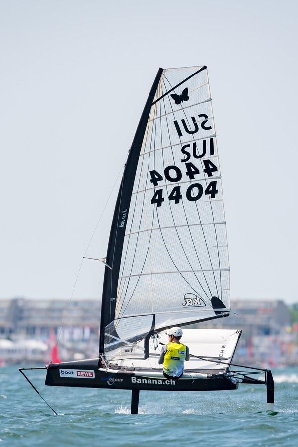 Adriano Petrino from Switzerland leads the fleet of the foiling dinghies into the final day of Kiel Week part 1 photo copyright Kiel Week / Sascha Klahn taken at Kieler Yacht Club and featuring the International Moth class