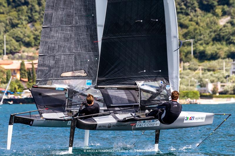 Nicolai Jacobsen goes head-to-head with Tom Slingsby (nearest to camera). Malcesine Pre-Worlds 2021 photo copyright Angela Trawoeger taken at Fraglia Vela Malcesine and featuring the International Moth class