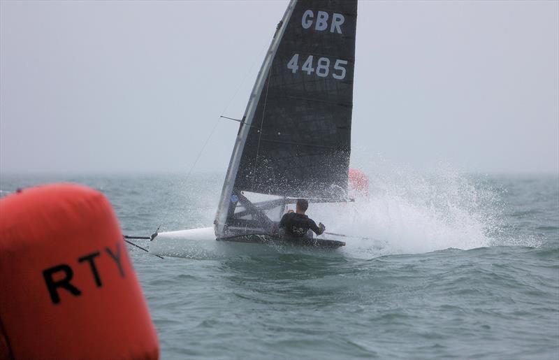 GBR 4485 Daniel Holman finishes Race 9 on Wetsuit Outlet International Moth UK Championship Day 4 photo copyright Mark Jardine taken at Royal Torbay Yacht Club and featuring the International Moth class