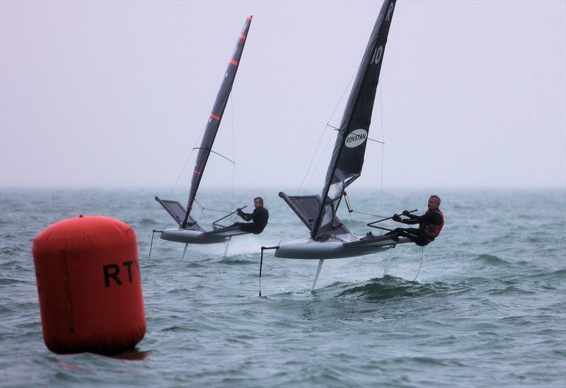 GBR 4990 Jason Belben and GBR 490 Alex Adams finish Race 9 on Wetsuit Outlet International Moth UK Championship Day 4 photo copyright Mark Jardine taken at Royal Torbay Yacht Club and featuring the International Moth class