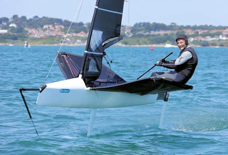 Wetsuit Outlet International Moth UK Nationals at the WPNSA Day 4 - GBR 4817 Philip Rees at the Race 12 finish line photo copyright Mark Jardine taken at Weymouth & Portland National Sailing Academy and featuring the International Moth class