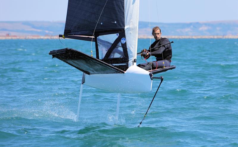 Wetsuit Outlet International Moth UK Nationals at the WPNSA Day 4 - GBR 4485 Dan Holman finishes Race 12 photo copyright Mark Jardine taken at Weymouth & Portland National Sailing Academy and featuring the International Moth class