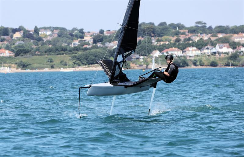 Wetsuit Outlet International Moth UK Nationals at the WPNSA Day 4 - GBR 4637 Paul Gliddon finishes Race 10 photo copyright Mark Jardine taken at Weymouth & Portland National Sailing Academy and featuring the International Moth class