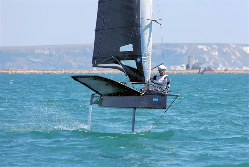 Wetsuit Outlet International Moth UK Nationals at the WPNSA Day 4 - GBR 3995 Simon Goodwin finishes Race 12 photo copyright Mark Jardine taken at Weymouth & Portland National Sailing Academy and featuring the International Moth class