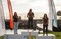 iQFoil Women's Podium: Tibi flanked by her teammates Kantor (left) and Morris (right) at the Lanzarote International Regatta © Sailing Energy