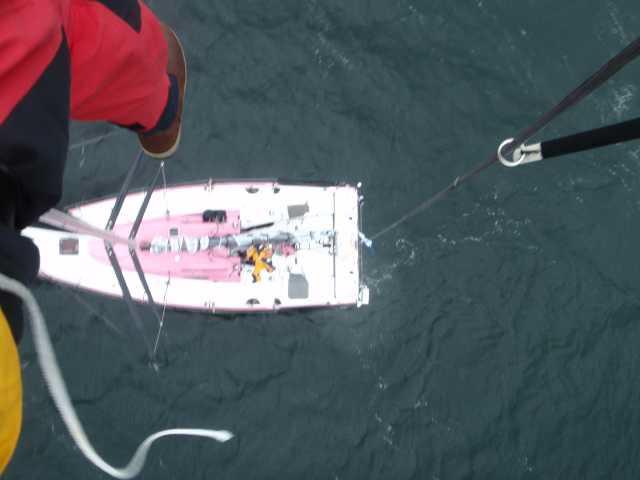 Conrad Manning attempts to fix the wind wand on top of Rare's mast in the Sevenstar Round Britain and Ireland Race  photo copyright Conrad Manning taken at Royal Ocean Racing Club and featuring the IRC class