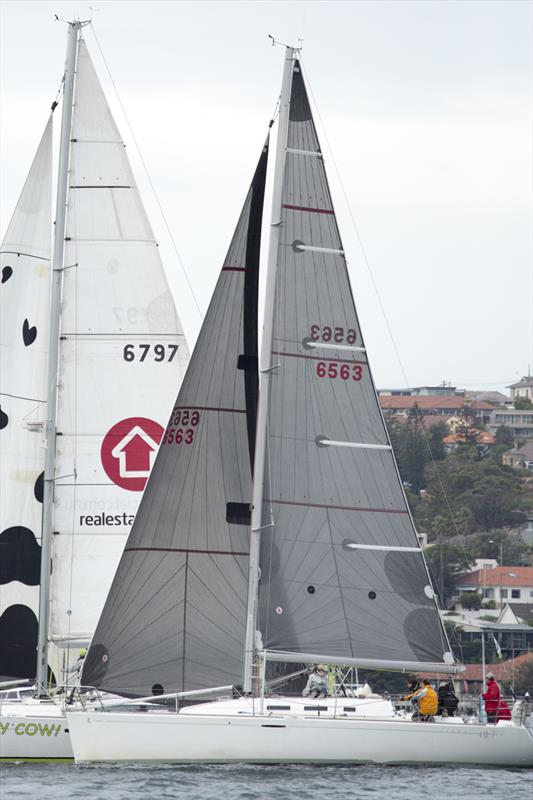 Holy Cow! and L'Attitude cosy up during race 10 of the CYCA Land Rover Winter Series photo copyright David Brogan / www.sailpix.com.au taken at Cruising Yacht Club of Australia and featuring the IRC class