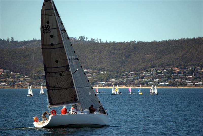 Eliza tacking down the Derwent with dinghy fleets in the background during the Hobart Combined Clubs Harbour Series photo copyright Peter Campbell taken at  and featuring the IRC class