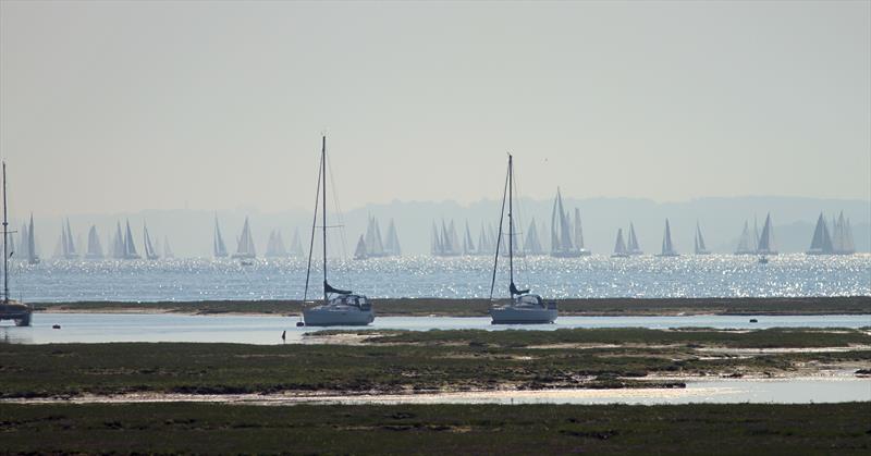 The leaders pass Hurst Castle and approach the Needles during the 2018 Round the Island Race - photo © Mark Jardine / YachtsandYachting.com